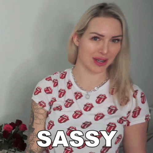 Sassy Girl Wearing Shirt With Rolling Stone Logos GIF