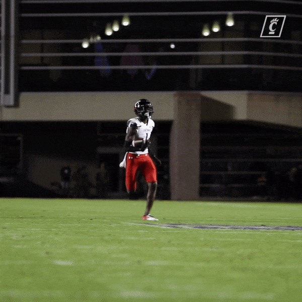 Sauce Gardner Running While Holding Football GIF