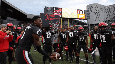 Sauce Gardner Slightly Throwing Football Upward GIF