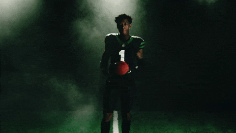 Sauce Gardner Tossing Football Between Hands GIF