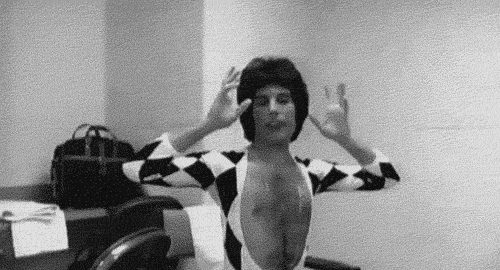 Saucy Queer Freddie Mercury Outstretched Arms GIF