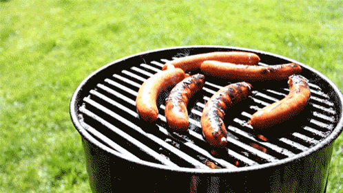 Sausages Cooking on Grill