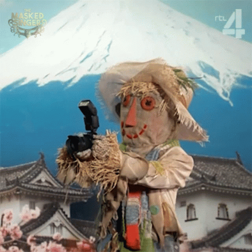 Scarecrow Taking Picture At Fuji Mountain GIF