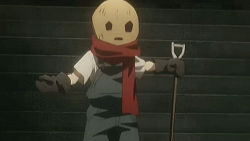 Scarecrow With Scarf and Shovel