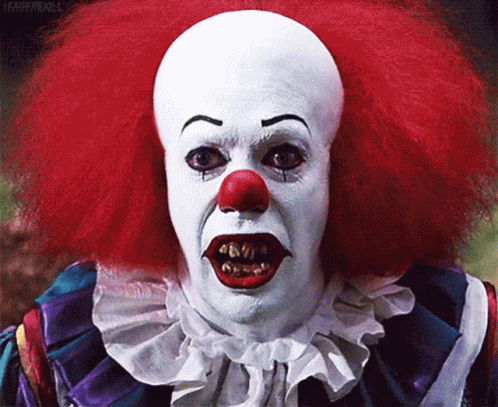 Scary Clown With Red Hair and White Face Paint
