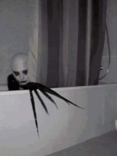 Scary Creature Sticking Head Out of Bath Tub