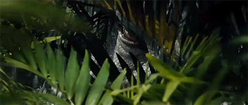 Scary Dinosaur Stalking Behind Bush GIF