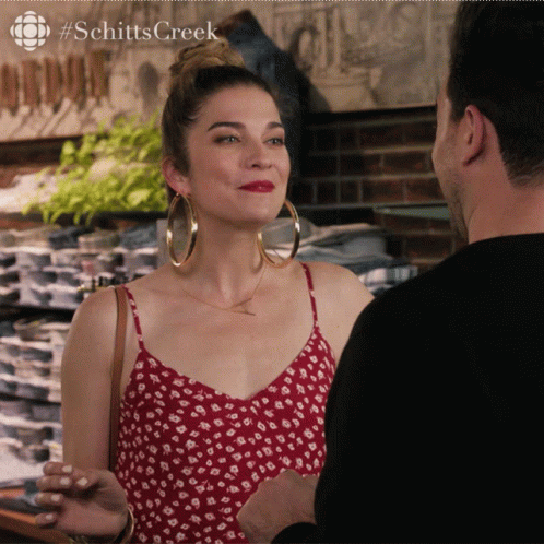 Schitt's Creek Woman Red Dress Man Black Shirt GIF