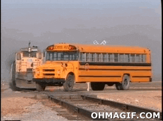 School Bus Driving On Train Tracks GIF