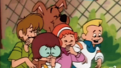 scooby doo and his friends are playing with a little girl