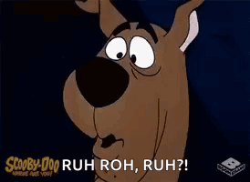 Scooby Doo Is Making A Funny Face And Saying `` Ruh Roh , Ruh '' . GIF