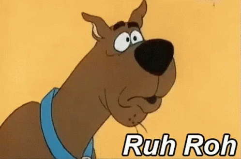 Scooby Doo Is Wearing A Blue Collar And Making A Funny Face With The Words Ruh Roh Below Him . GIF