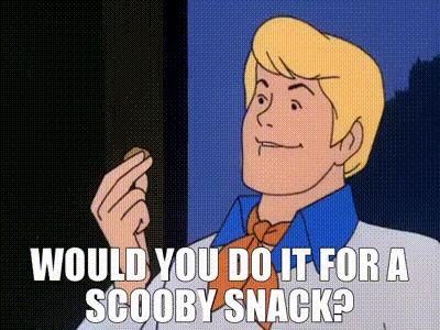 scooby doo says would you do it for a scooby snack while eating a cookie .