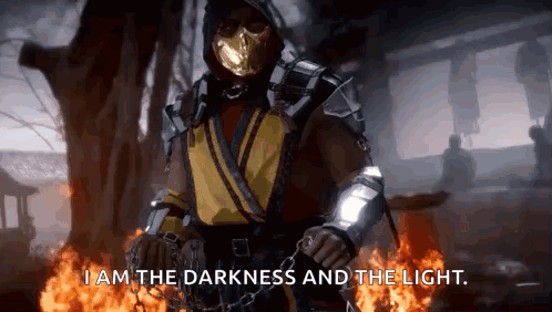 Scorpion From Mortal Kombat Is Standing In Front Of A Fire And Saying I Am The Darkness And The Light GIF