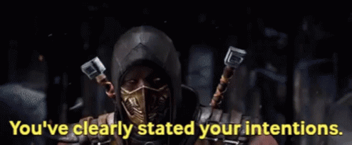 Scorpion Mortal Kombat Wearing Mask Holding Metal