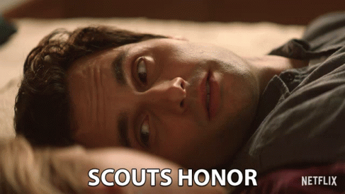 Scouts Honor Man Laying on Bed