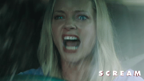 Screaming Woman in Car With Scream Text