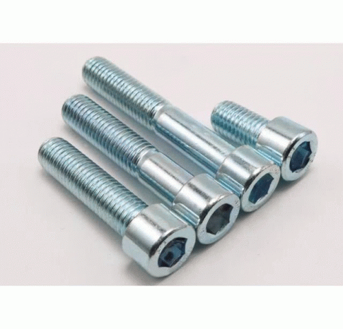 Screws Stacked On White Surface GIF