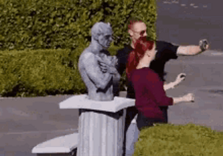 Sculpture Scaring Tourist GIF