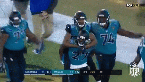 Seahawks and Jaguars Players Walking on Field
