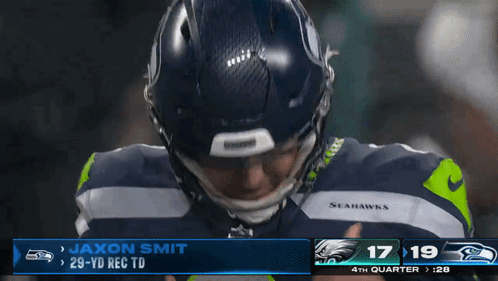 Seahawks Player Jaxon Smith In Front Of Scoreboard GIF