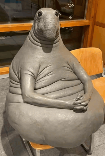Seal Statue Sitting Crossed Arms