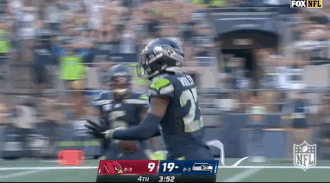 Seattle Seahawks Riq Woolen Running Freely GIF