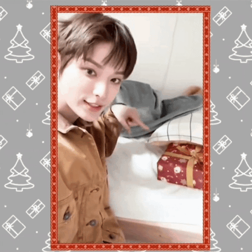 Secret Santa Pointing Gift GIF