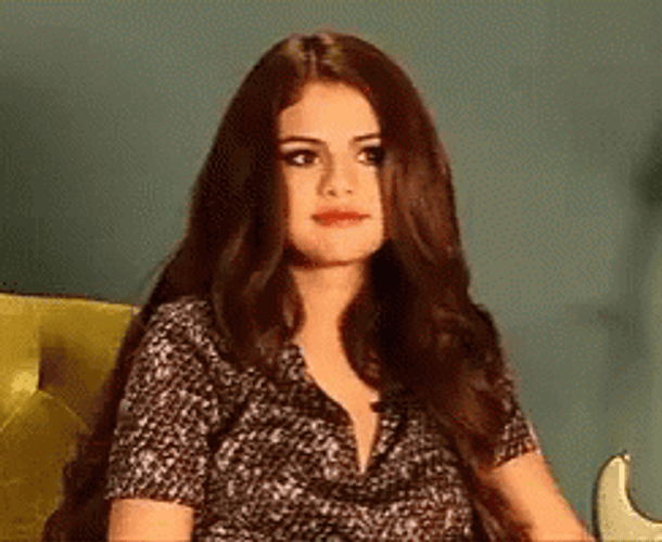 Selena Gomez Shrug GIF