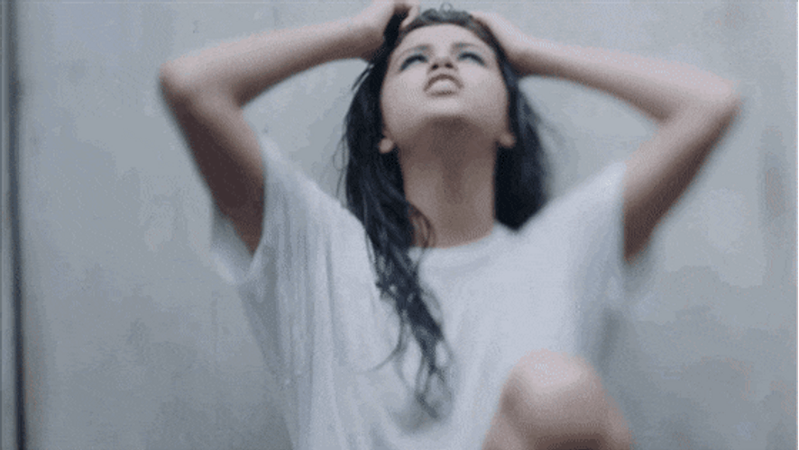 Selena Gomez Singing With Her Wet Tshirt GIF