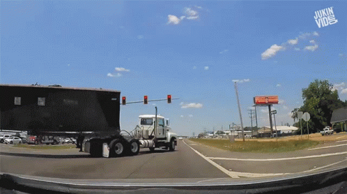 Semi Truck Crash Down While Turning GIF