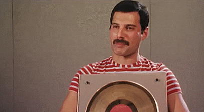 Serious Freddie Mercury Wink GIF