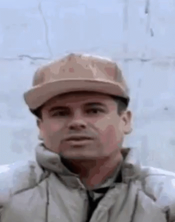 Serious Man in Hat and Jacket