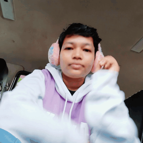 Serious Man in Purple Hoodie with Headphones
