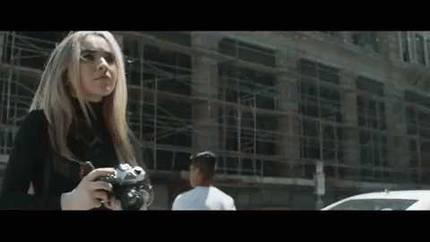 Serious Sabrina Carpenter Taking A Photo GIF