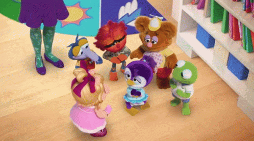 Sesame Street Characters Around Girl GIF