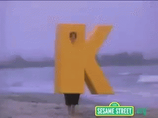 Sesame Street Sign Person Holding Yellow K