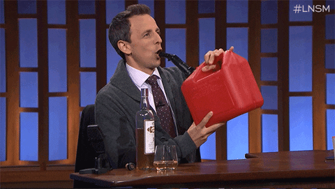 Seth Meyers Drinking Gas GIF