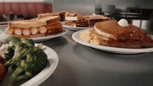 Several Plates Of Broccoli Pancakes And Sandwiches GIF