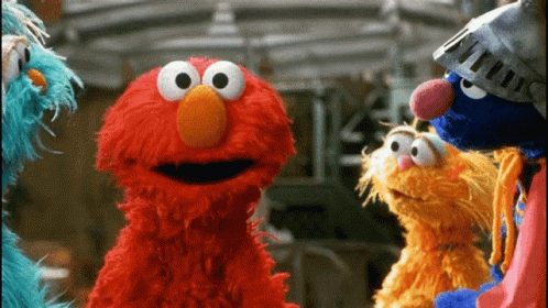 Several Sesame Street Characters Including Elmo And Cookie Monster Are Standing Next To Each Other GIF