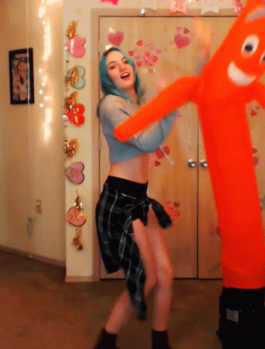 Sexy Lady Dancing With Inflatable Tube Man GIF