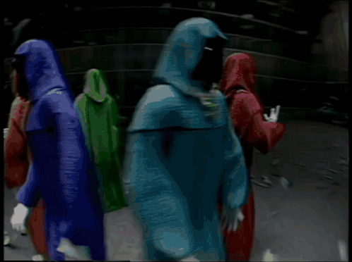 Shadow Wizard And Money Gang Are Holding Signs In A Dark Room GIF