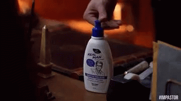 Shaquille O'Neal Holding Gold Bond Shampoo