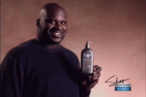 Shaquille O'Neal Holding Gold Bond Shampoo