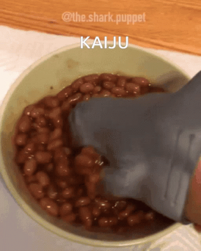 Shark Puppet Pouring Beans Into Bowl
