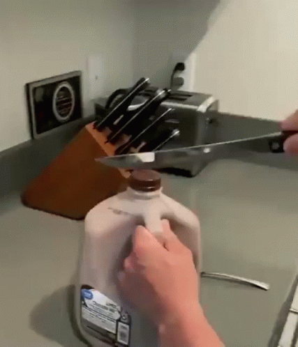 Sharp Knife Cutting Choco Milk Gallon GIF