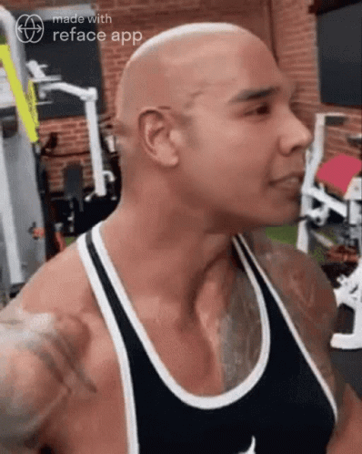 Shaved Head Man in Black Tank Top