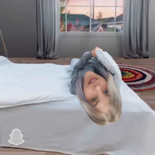 She Rolling On The Bed Before Nap Time GIF