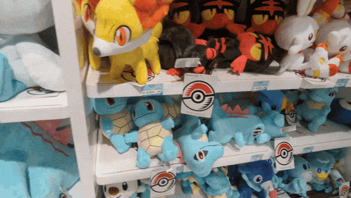 Shelf Full of Stuffed Pokemon Squirtle and Flareon