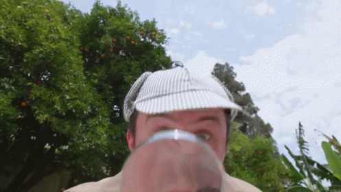 Sherlock Holmes Using Magnifying Glass GIF